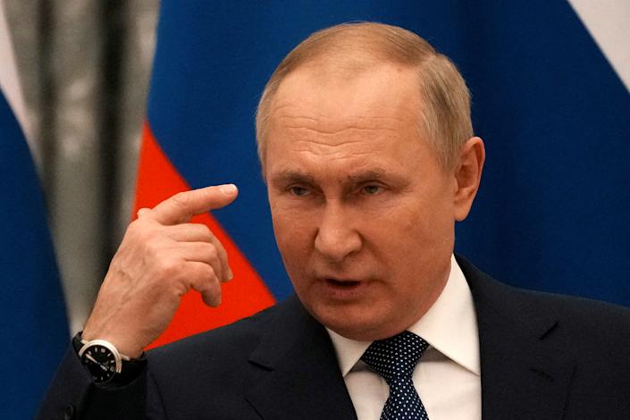 Russian President Vladimir Putin delivers a speech at a press conference in Moscow.