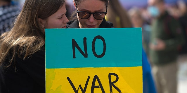 A demonstrator holds a sign during the demonstration in Plaza de la Marina.  Ukrainian residents of Malaga, Spain, who number about 11,000 Ukrainians, continue to demonstrate for peace and against the invasion of Russian President Vladimir Putin.