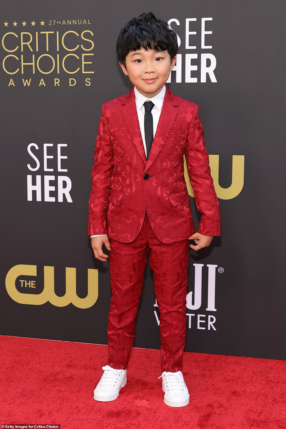 Adorable: Alan Kim, nine, wears a red plaid suit with sneakers