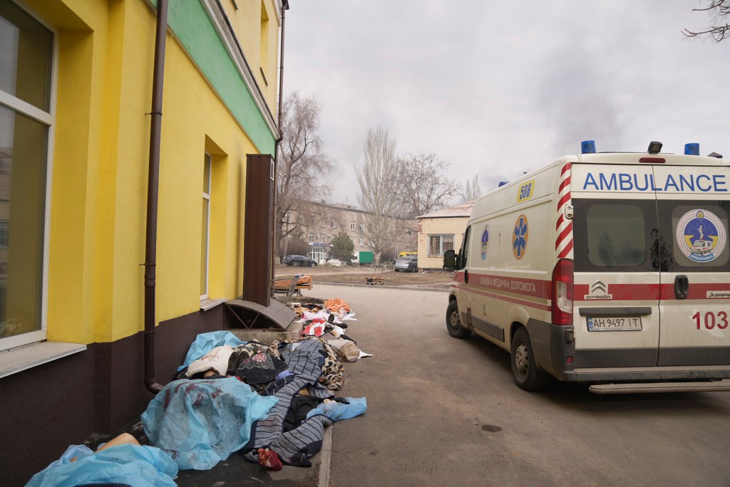 The bodies of those killed in the bombing are covered outside Hospital No. 3 in Mariupol on March 15, 2022.