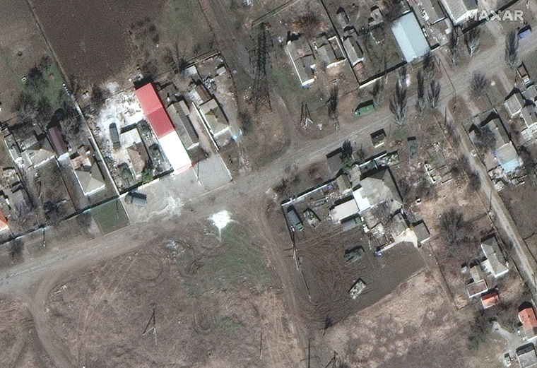 Russian military vehicles were seen parked right next to houses northeast of Mariupol. 