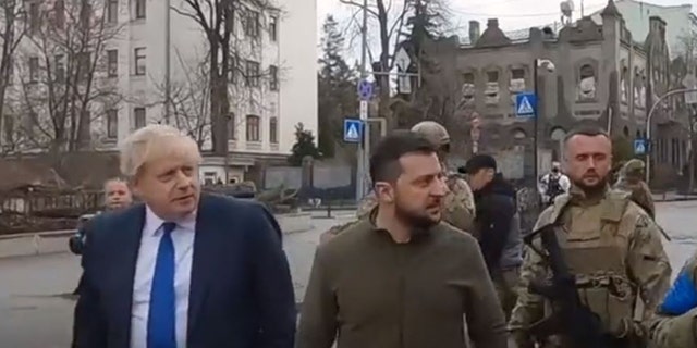 On the left, the Prime Minister of the United Kingdom, and Ukrainian President Volodymyr Zelensky walk the streets of Kyiv. 