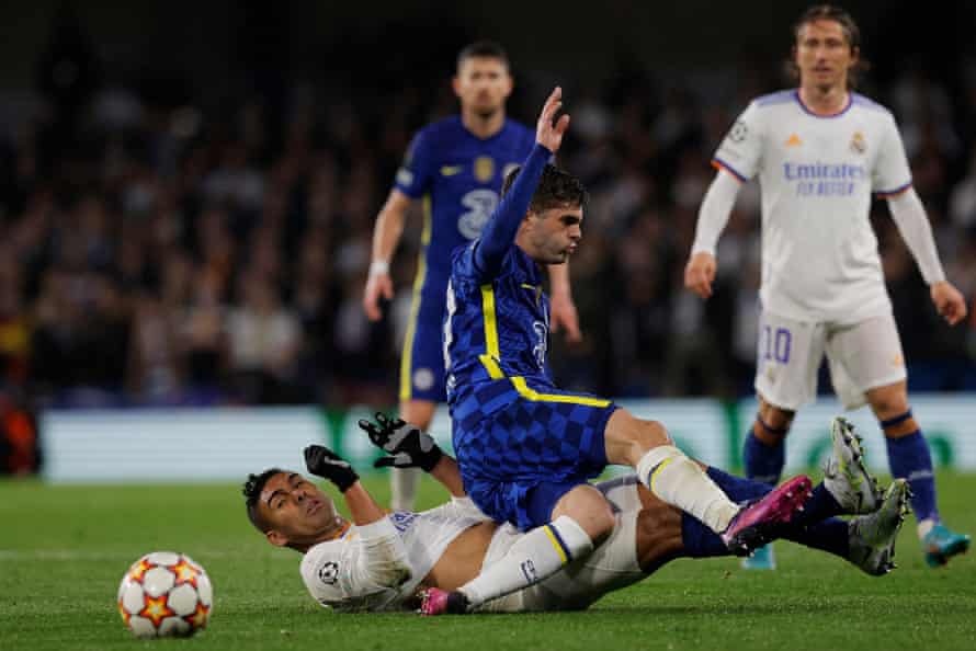 Real Madrid's Casemiro (left) treats Chelsea's Christian Pulisic as seen by Luka Modric (right).