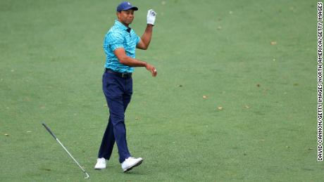 Woods reacts with his shot on the ninth hole during the second round of the Masters.