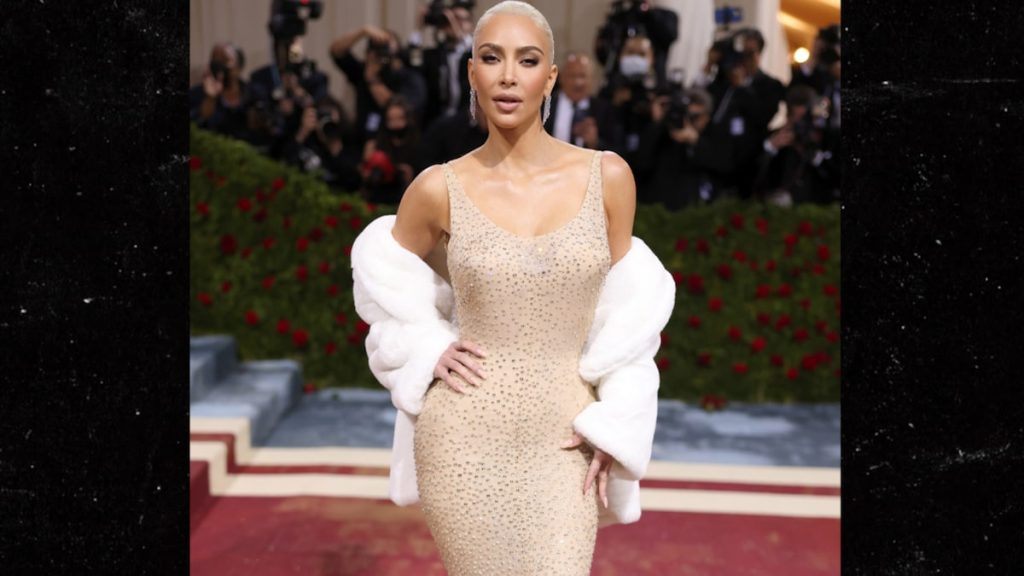 Kim Kardashian wears a unique Marilyn Monroe dress to a party with blonde hair