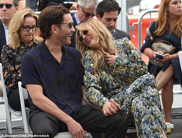 It Takes Two: The Big Bang Theory star had a special character plus one sitting next to her: boyfriend Tom Belfry, 39