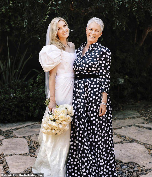 Mum of two: Jamie and the 75-year-old British Baron are also parents to 35-year-old adopted daughter Annie (left), who tied the knot with Jason Wolf in 2019