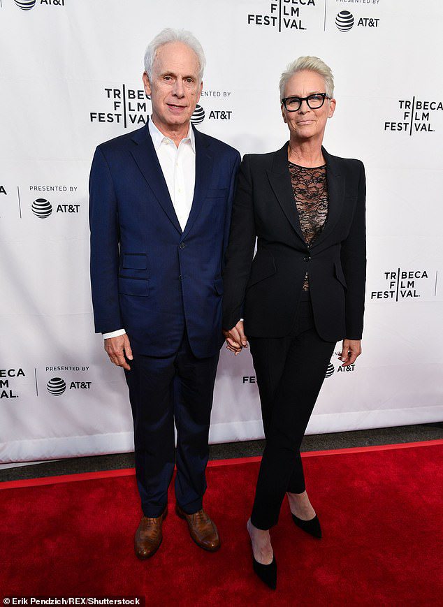 'She Speaks a New Language': Last year, the Halloween Kills producer star admitted that she and her husband of 37 years - Emmy winner Christopher Guest (L, pictured in 2019) - 'still slip occasionally' 'By misleading Ruby and calling her by her birth name