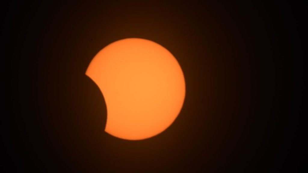 A rare black moon solar eclipse takes a bite out of the sun over South America