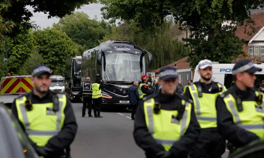 There is a heavy police presence outside the Tottenham Hotspur stadium as the Arsenal team bus arrives.