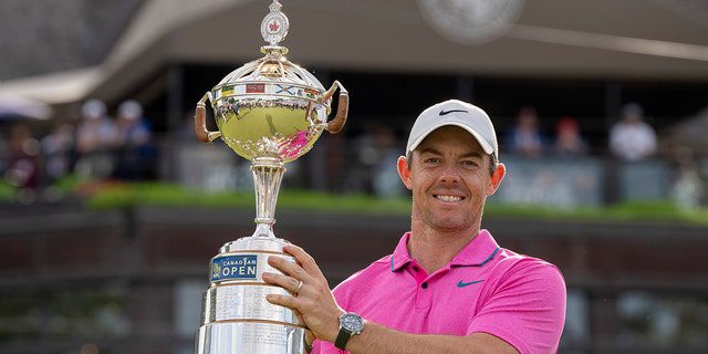 Rory McIlroy lifts the trophy after winning the Canadian Open in Toronto on Sunday, June 12, 2022.