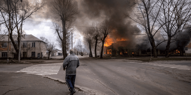 A man walks on a street in Severodonetsk, eastern Ukraine, after shelling there on Wednesday. 