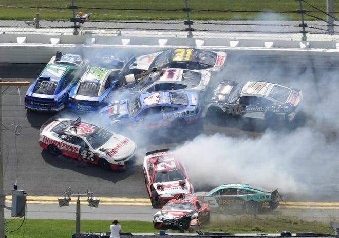 Austin Dillon (#3) makes his way through the chaos and into the lead after a big crash in Turns 1 and 2.