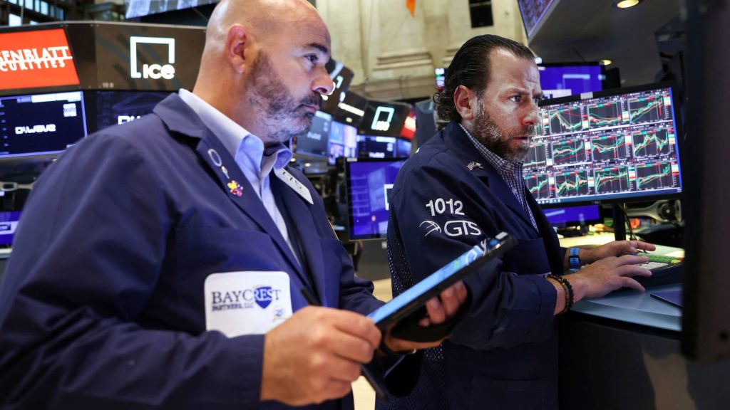 Dow drops 300 points as traders fret about FedEx warning, Wall Street heads for big weekly loss