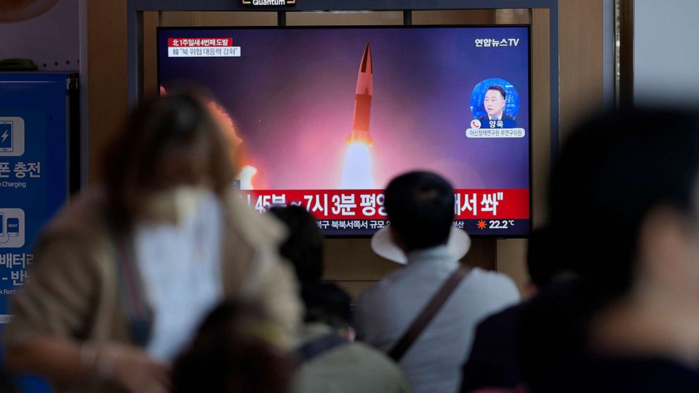 PHOTO: A TV screen showing a news program talking about a North Korean missile launch with file images, seen at the Seoul Railway Station in Seoul, South Korea, October 1, 2022. 