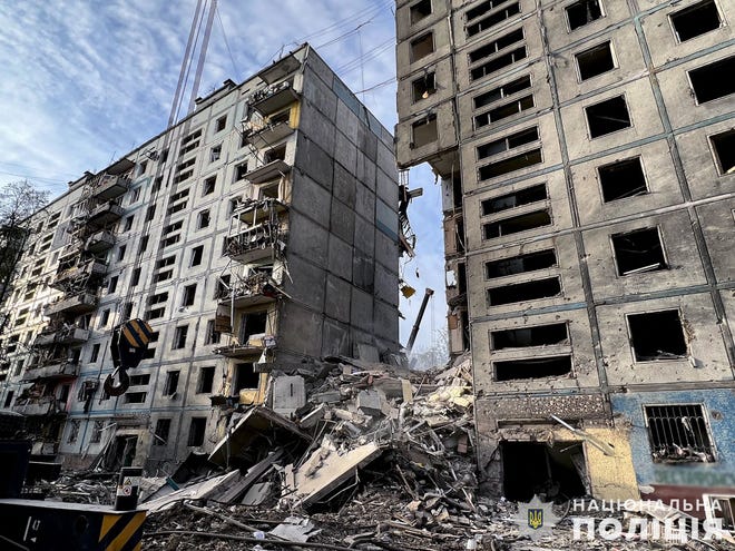 This photo posted by the Ukrainian National Police and released on October 9, 2022, shows an apartment building after a strike in Zaporizhia, amid the Russian invasion of Ukraine.