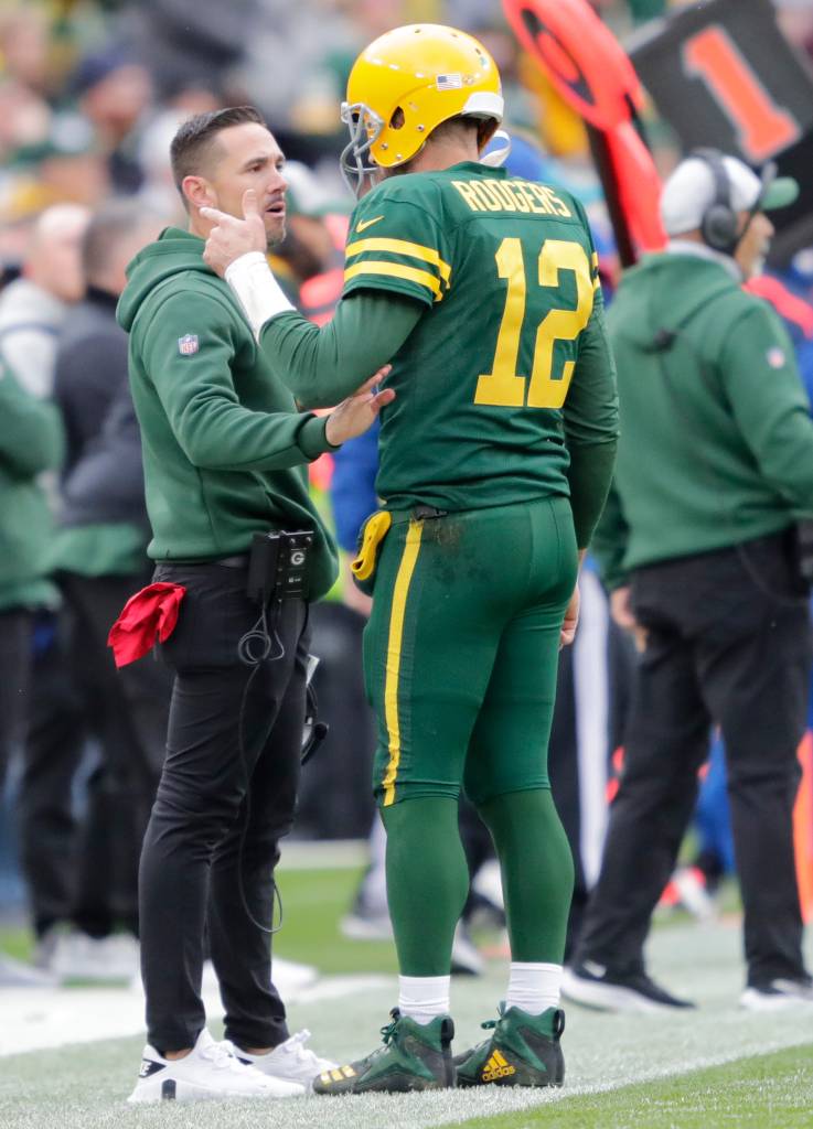 When calling up his teammates, Aaron Rodgers necessarily calls his coach