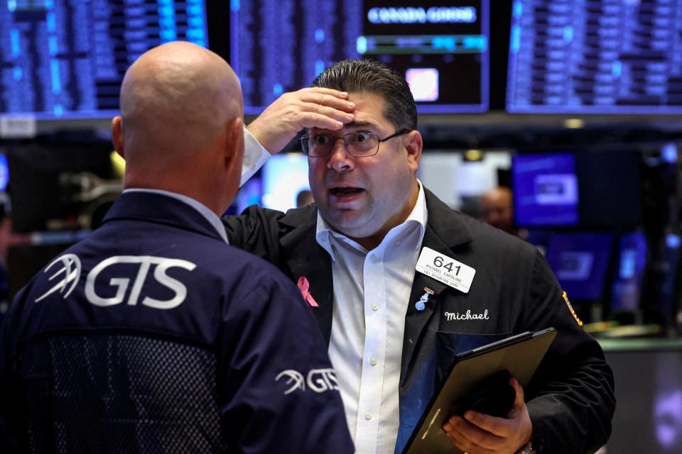 Traders work on the floor of the New York Stock Exchange (NYSE) in New York City, US, October 7, 2022. REUTERS/Brendan McDermid