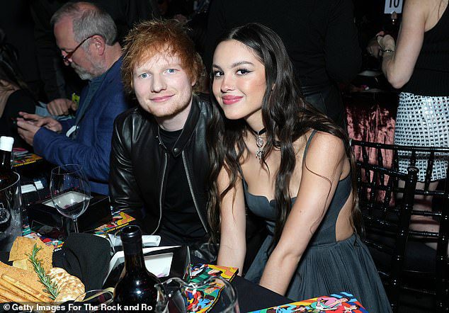 Happy Friends: Olivia sat next to her happy assistant Ed Sheeran
