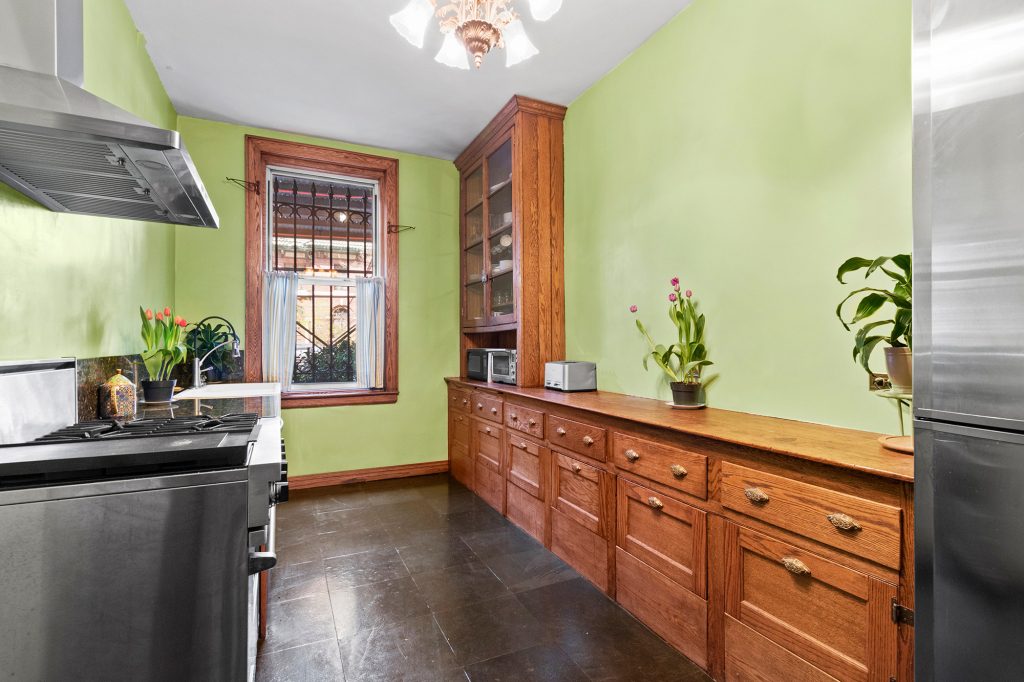 GRI unit's kitchen features renovated original oak cabinets.