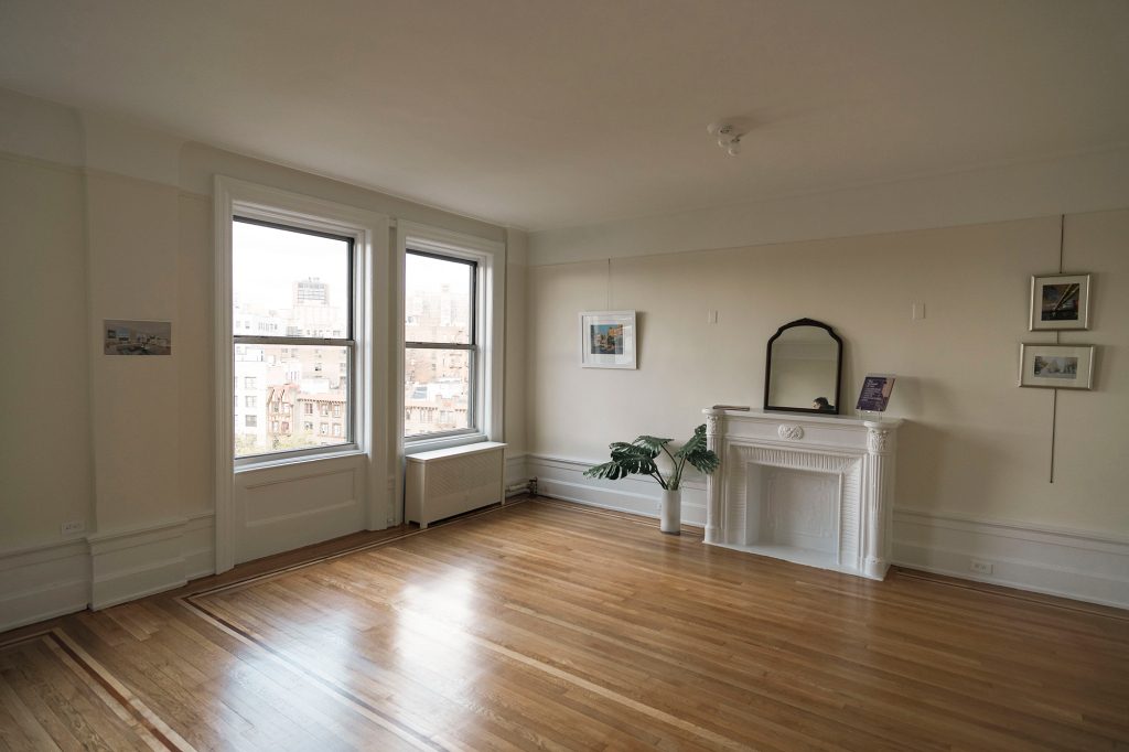 Unit 8H, located upstairs, also has ample exposure to light, as well as hardwood floors and moldings.