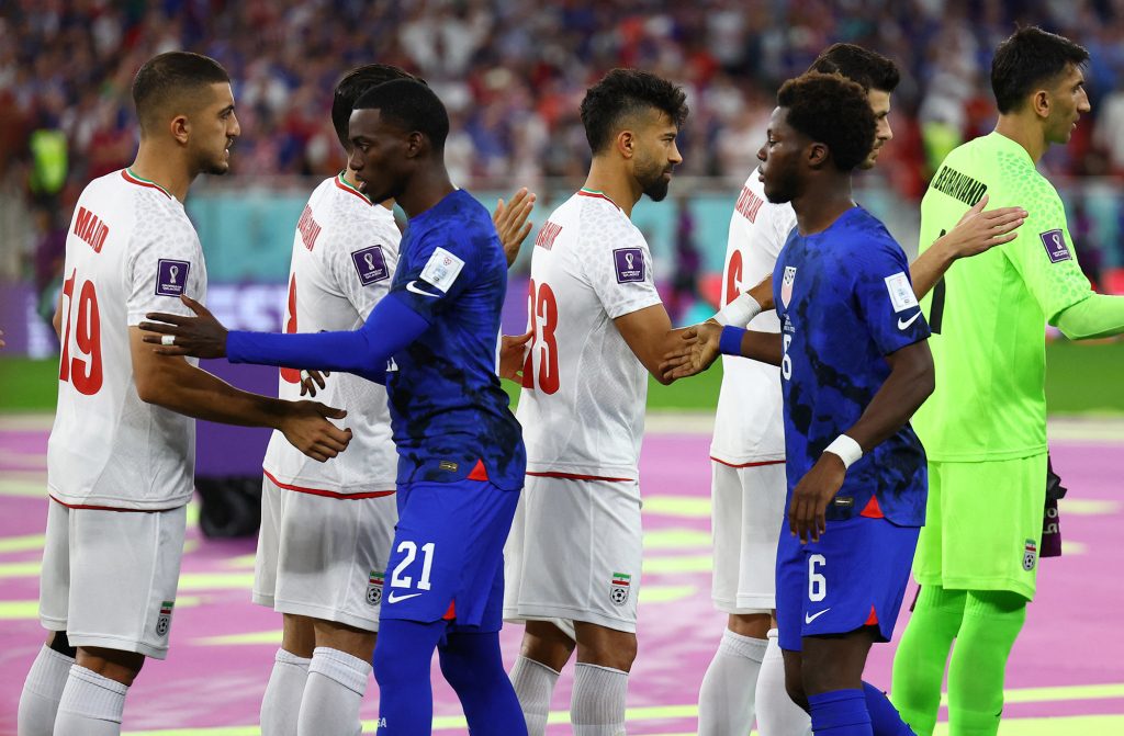 Iran's match against the United States began with a sporting handshake despite threats to the players and unrest in their country.