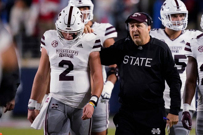 Mississippi State coach Mike Leach gives quarterback Will Rogers (2) during the first half of an NCAA college football team game against Mississippi in Oxford on Thursday, November 24.