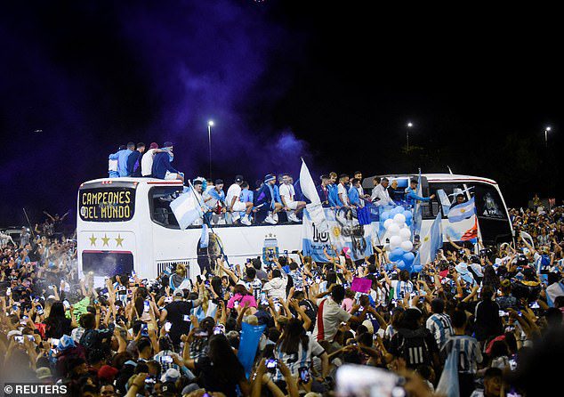 Fans lined the streets in the middle of the night trying to catch a glimpse of the victorious Argentina soccer team as they made their way through Buenos Aires in an open-top bus.